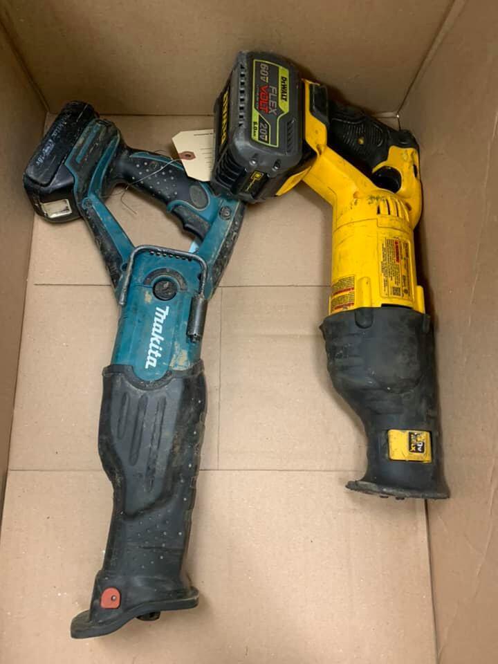 a few power drills in a box