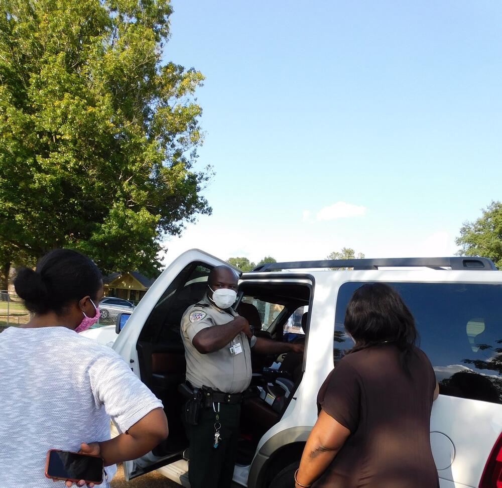 TCSO Certified Car Seat Technician, Captain William Smith, shows guardians who to properly install car seats and restrain children in their correctly sized seat.