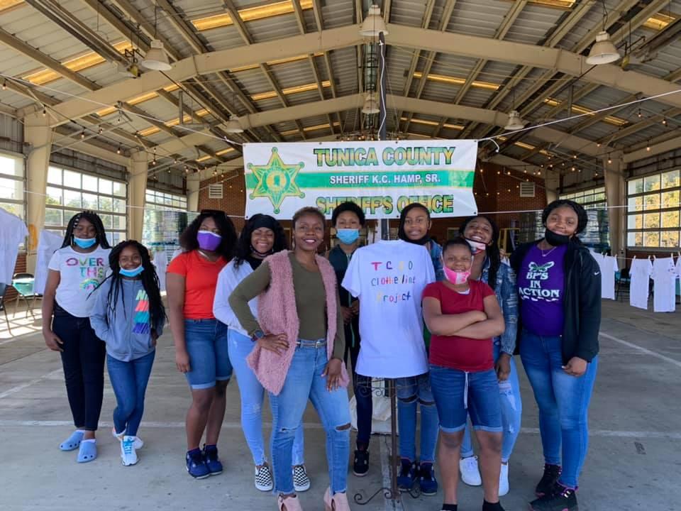 Members of Butterfly Project pose for picture at Clothesline Project.